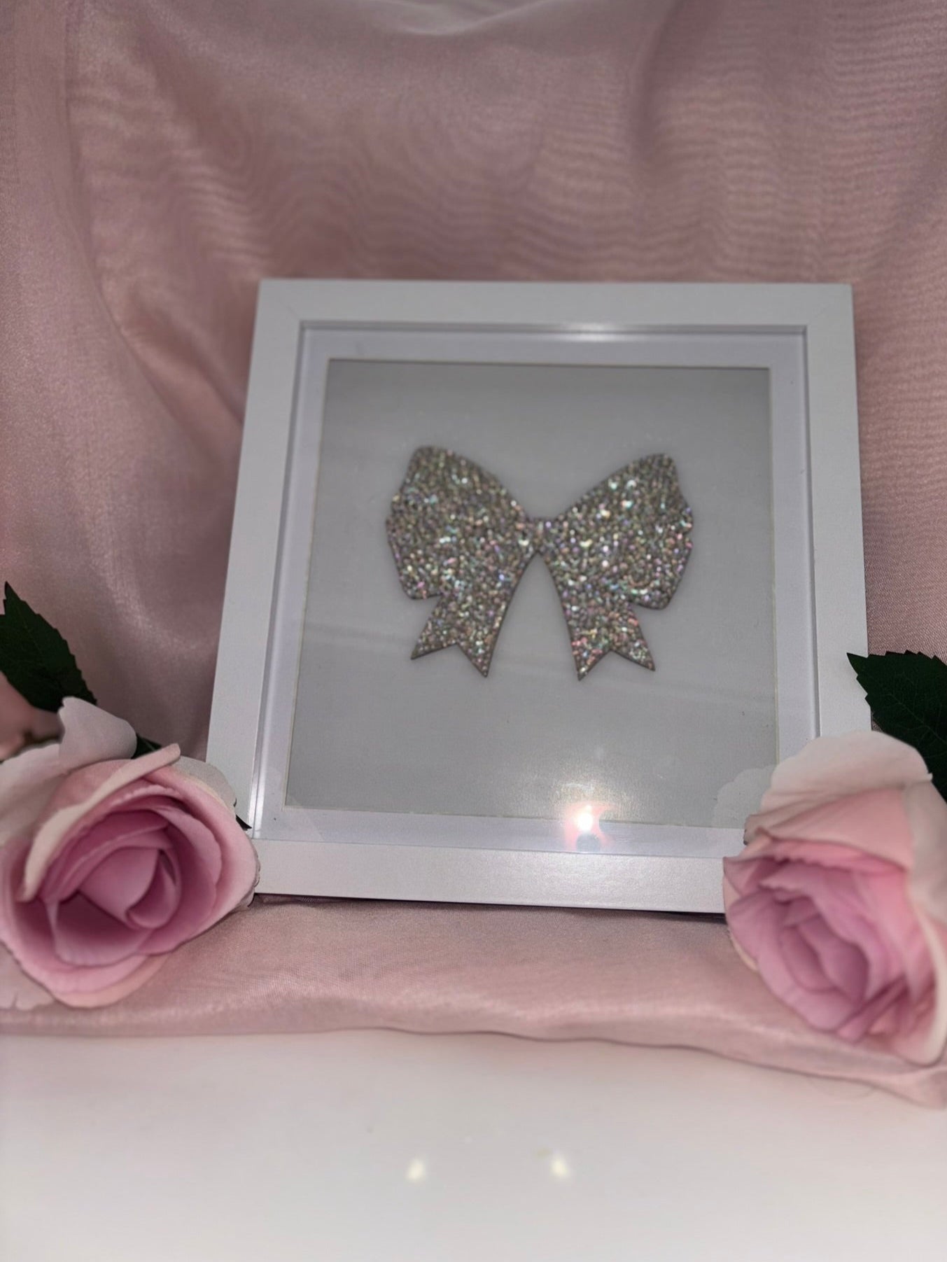 Wooden bow in box frame.
