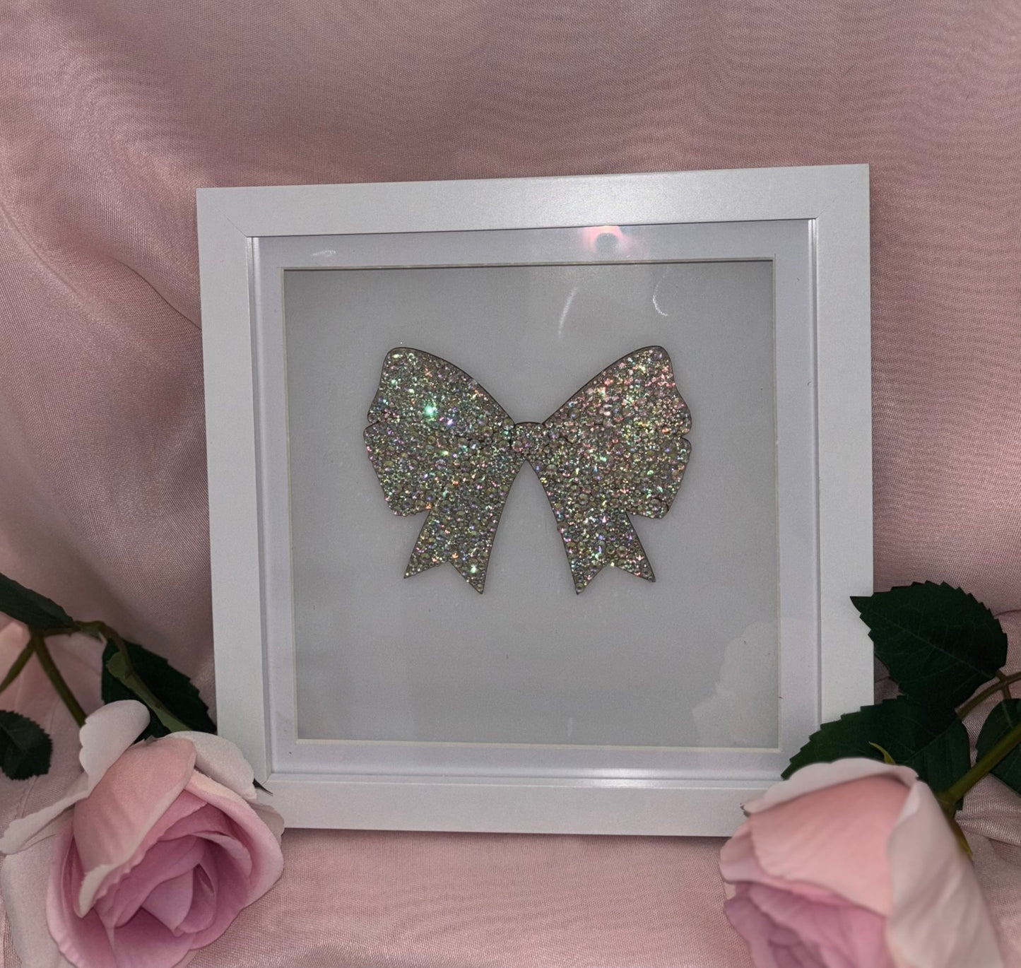 Wooden bow in box frame.