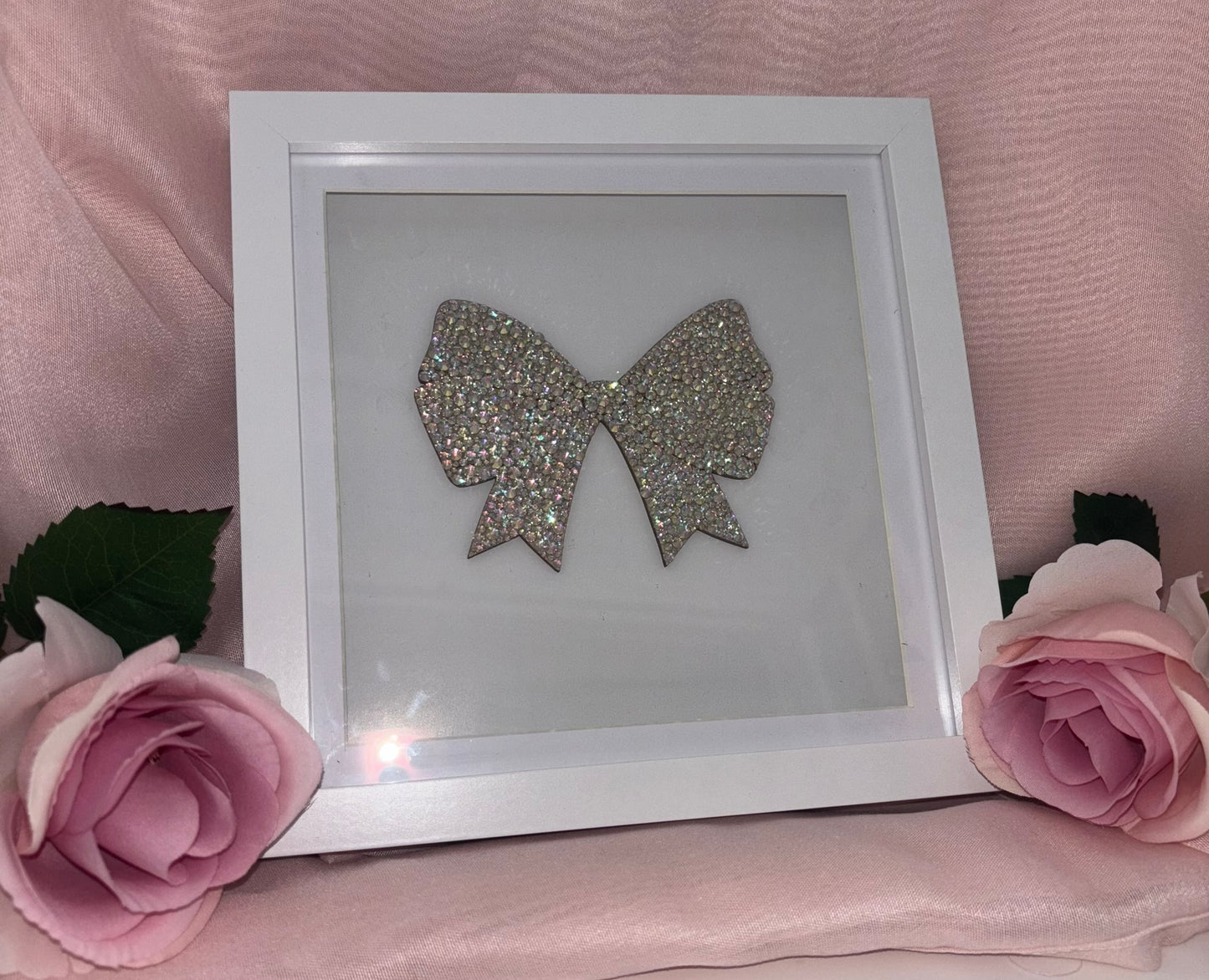 Wooden bow in box frame.