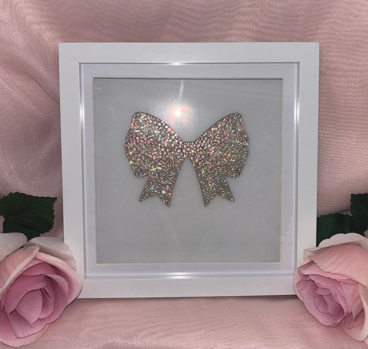 Wooden bow in box frame.