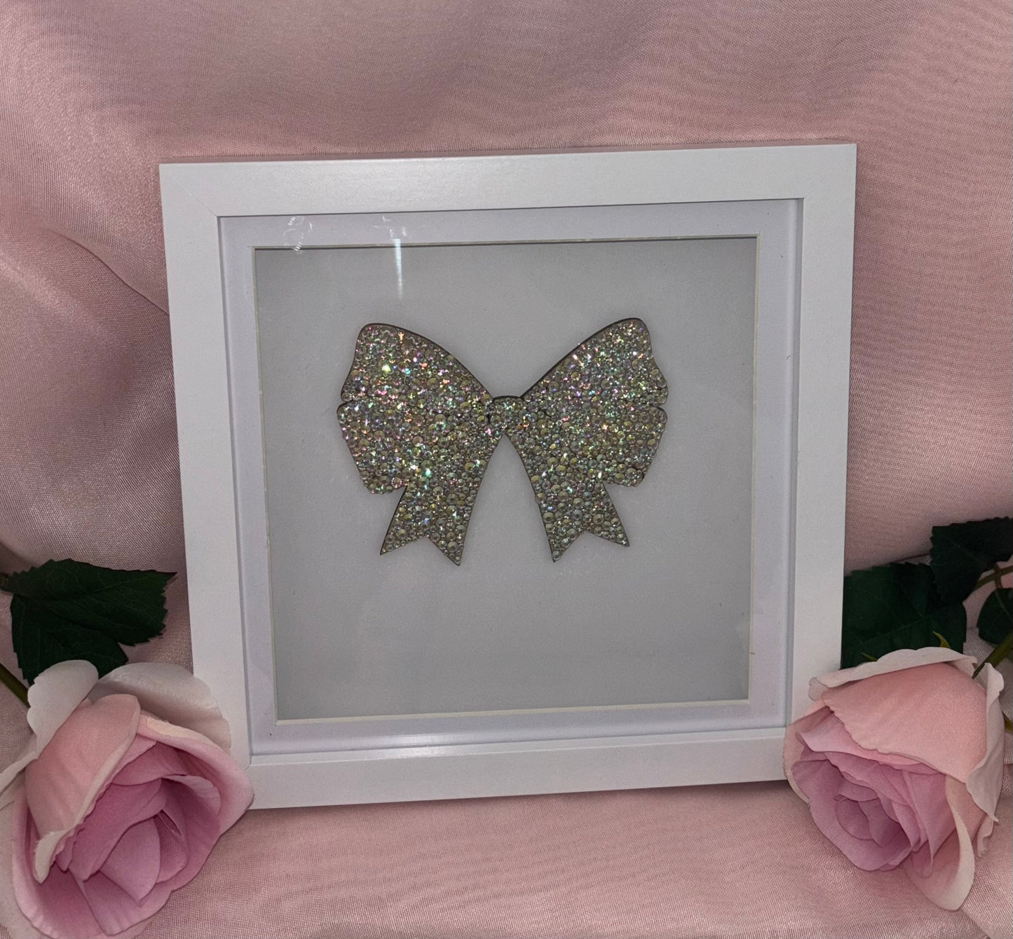 Wooden bow in box frame.
