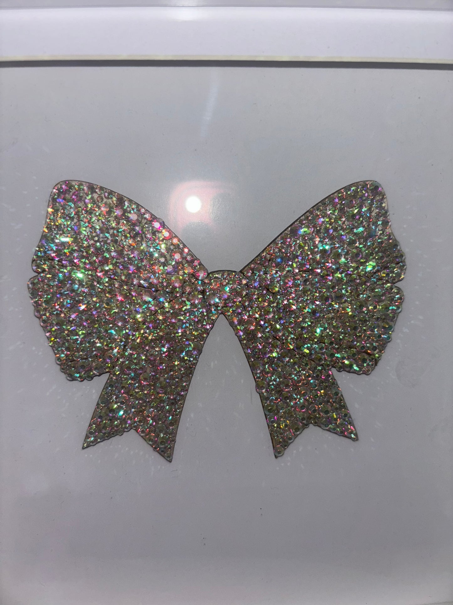 Wooden bow in box frame.