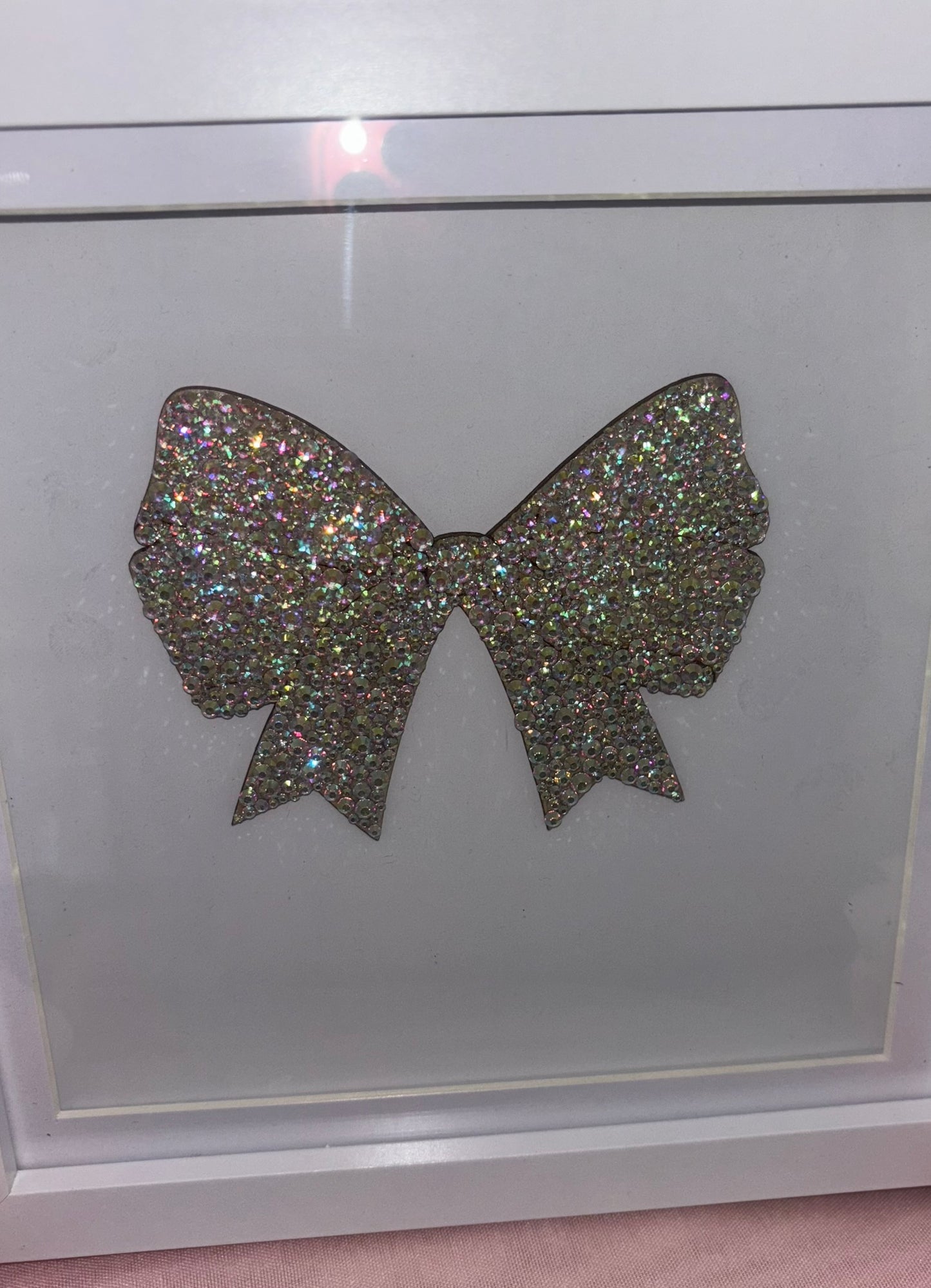 Wooden bow in box frame.