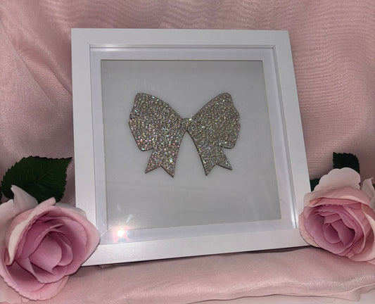 Wooden bow in box frame.