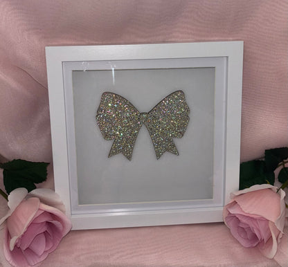 Wooden bow in box frame.