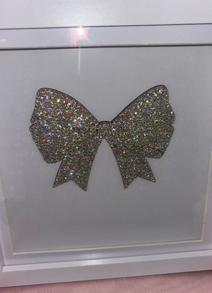 Wooden bow in box frame.